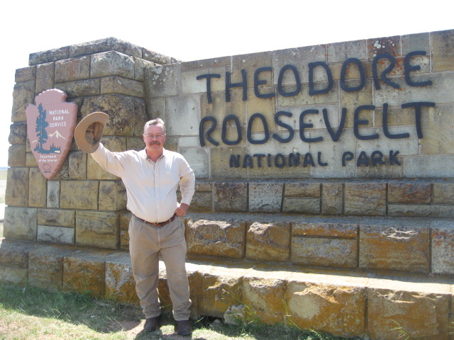 Joe tipping his hat at the Theodore Roosevelt National Park entrance
